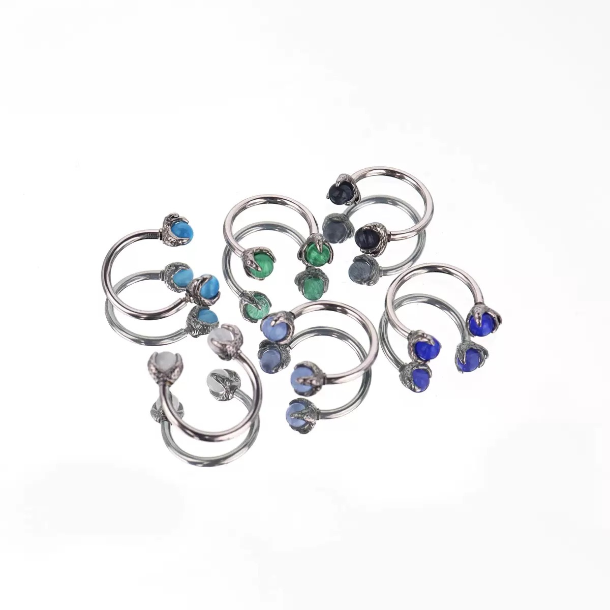 Internally threaded stainless steel lip rings, titanium steel lip rings in the shape of dragon claws with cat's eye stones, ear cartilage rings, niche internally threaded lip studs, body piercing jewelry.