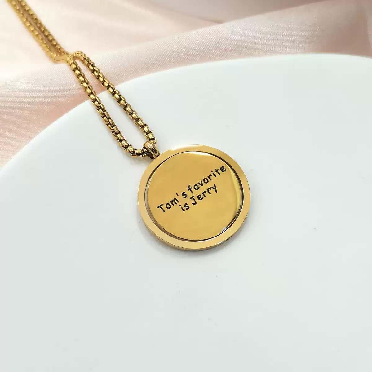 Original Rotating Round Plate Titanium Steel Necklace. It doesn't fade and serves as a stress-relieving accessory. It allows DIY engraving and makes for a great couple's gift.