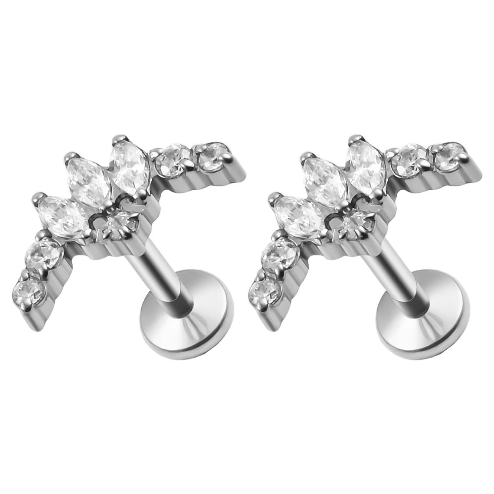 G23 titanium piercing jewelry inlaid with cubic zirconias, including internally threaded and internally toothed ear studs, lip studs, nose studs, and helix ear studs.